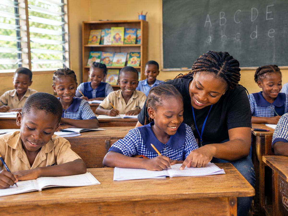 Nigerian children learning together in a bright community classroom
